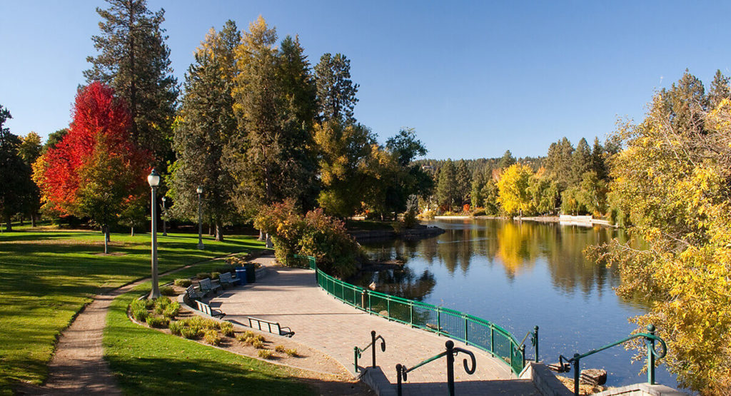 sidewalk and benches along the river