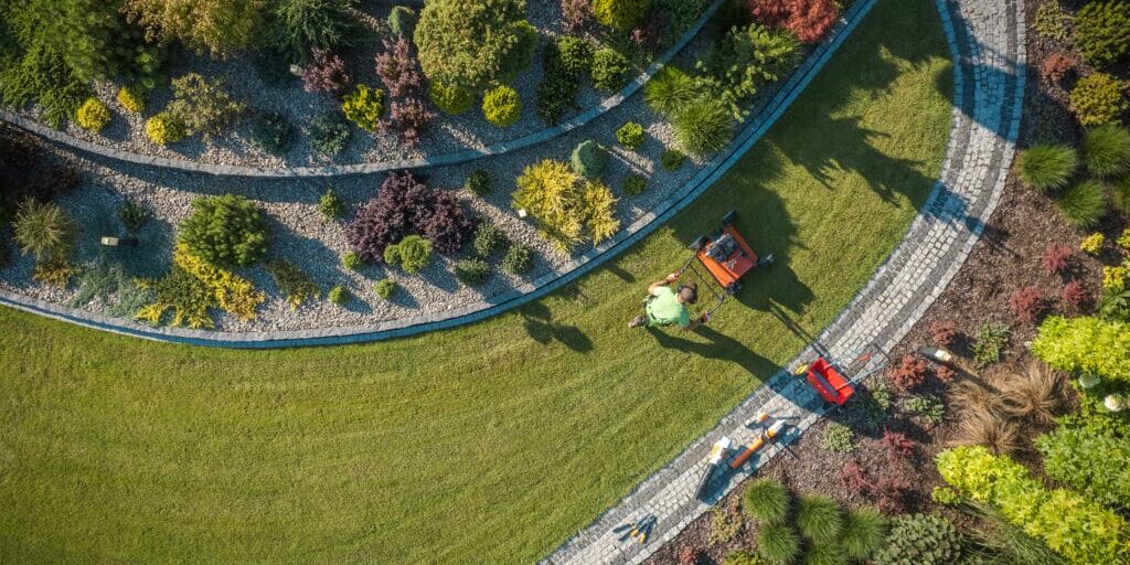 ce landscape aerial view of landscaper aerating clients lawn