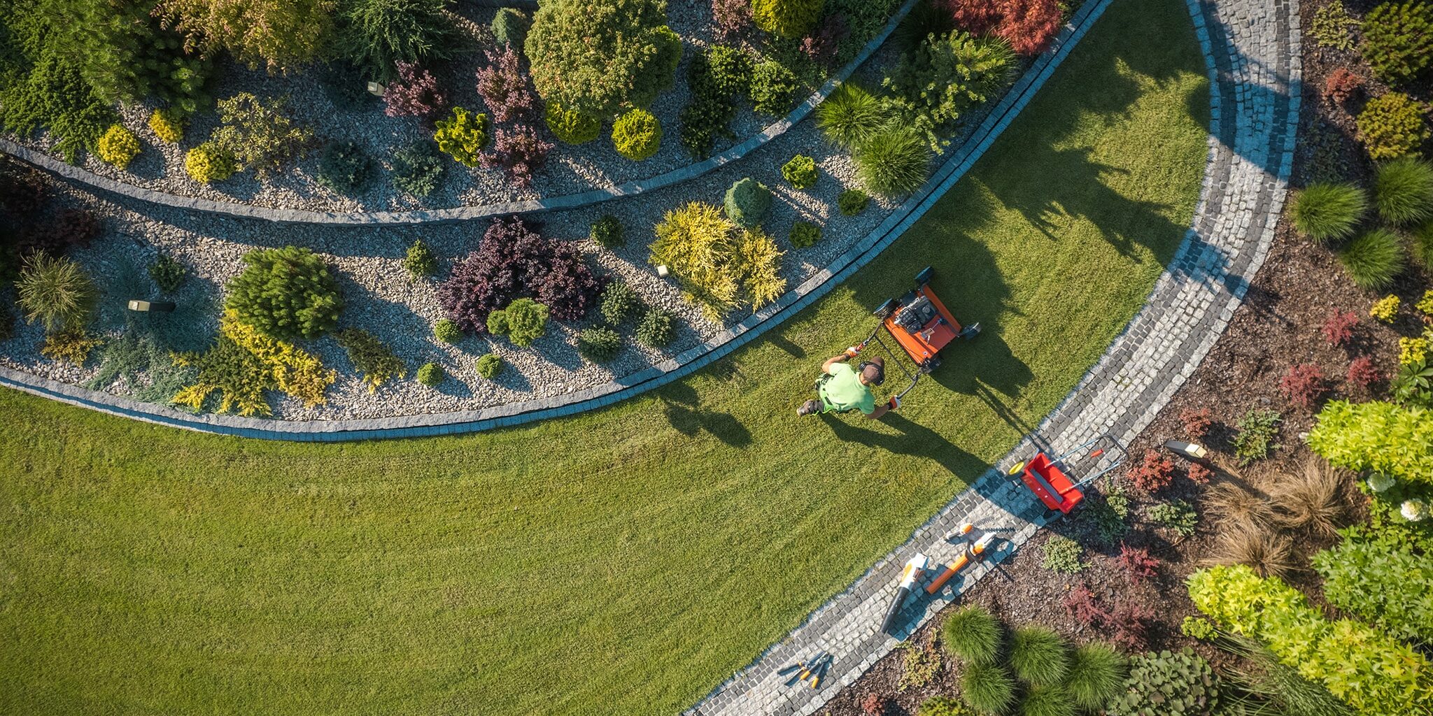 ce landscape aerial view of landscaper aerating clients lawn